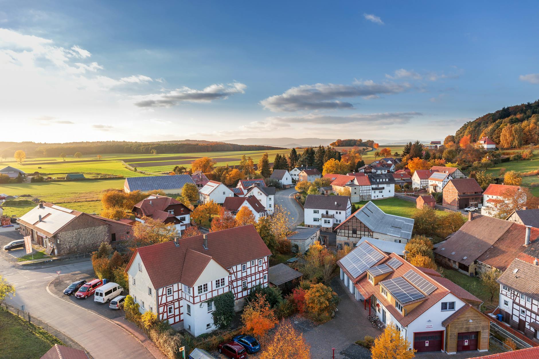 Charming aerial view of a rural village in autumn with vivid colors and clear skies. Charming aerial view of a rural village in autumn with vivid colors and clear skies.