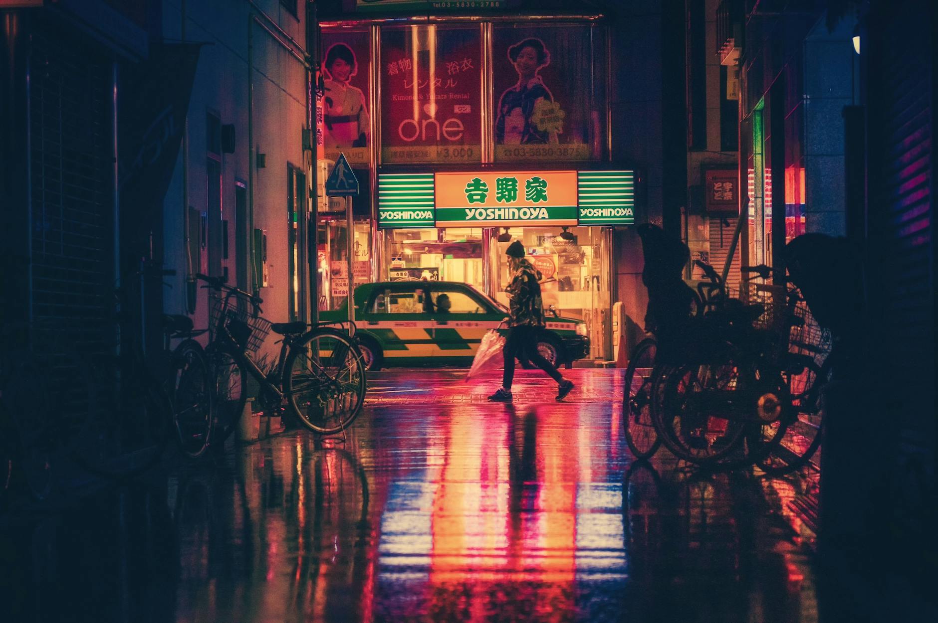 Atmospheric night cityscape featuring neon lights, wet streets, and urban life in Tokyo. Atmospheric night cityscape featuring neon lights, wet streets, and urban life in Tokyo.