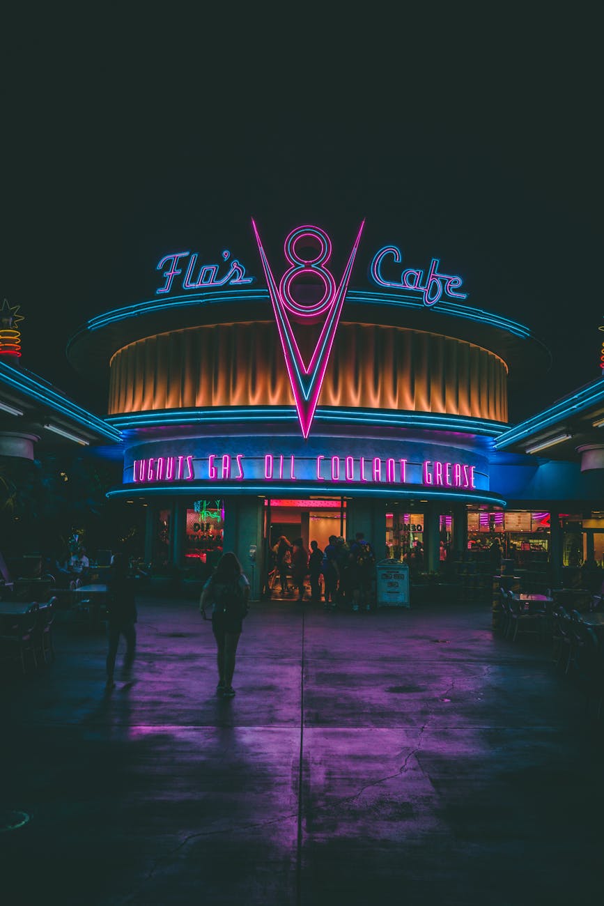 Experience the retro neon glow of Flo’s V8 Café in Anaheim at night, capturing its nostalgic charm and lively atmosphere.