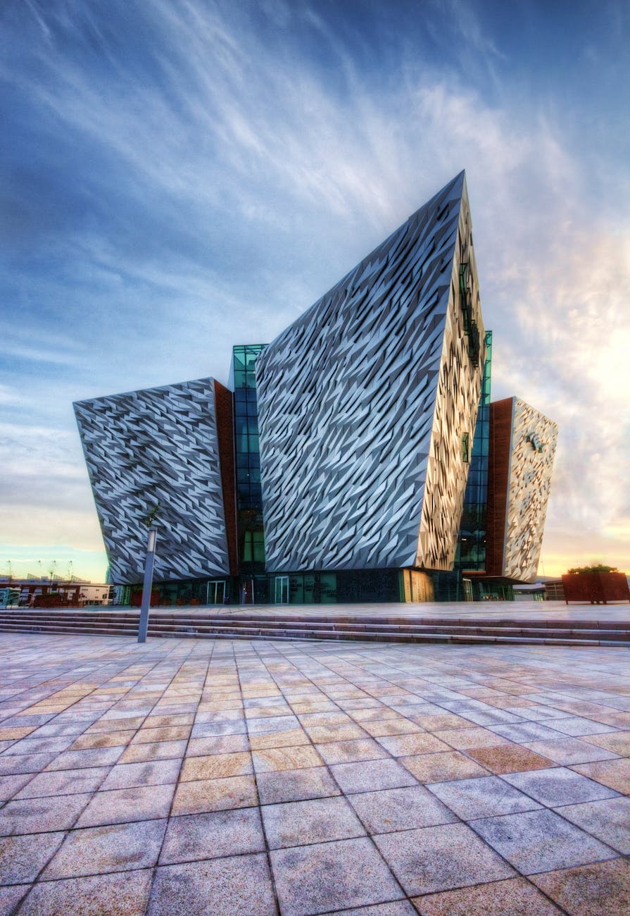 Impressive modern design of the Titanic Belfast museum, showcasing unique architectural style. Impressive modern design of the Titanic Belfast museum, showcasing unique architectural style.