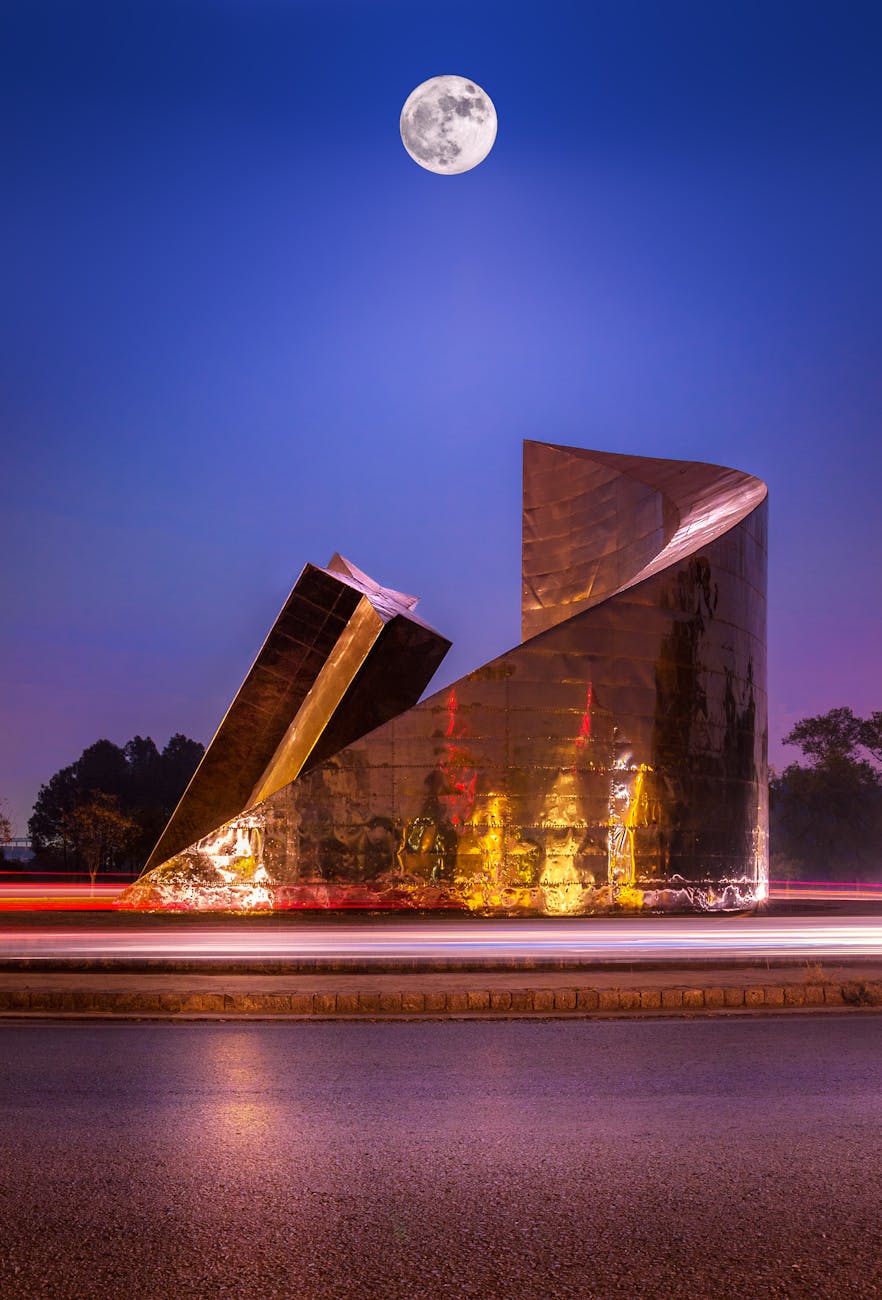 Modern sculpture illuminated under a full moon in Islamabad at night. Modern sculpture illuminated under a full moon in Islamabad at night.
