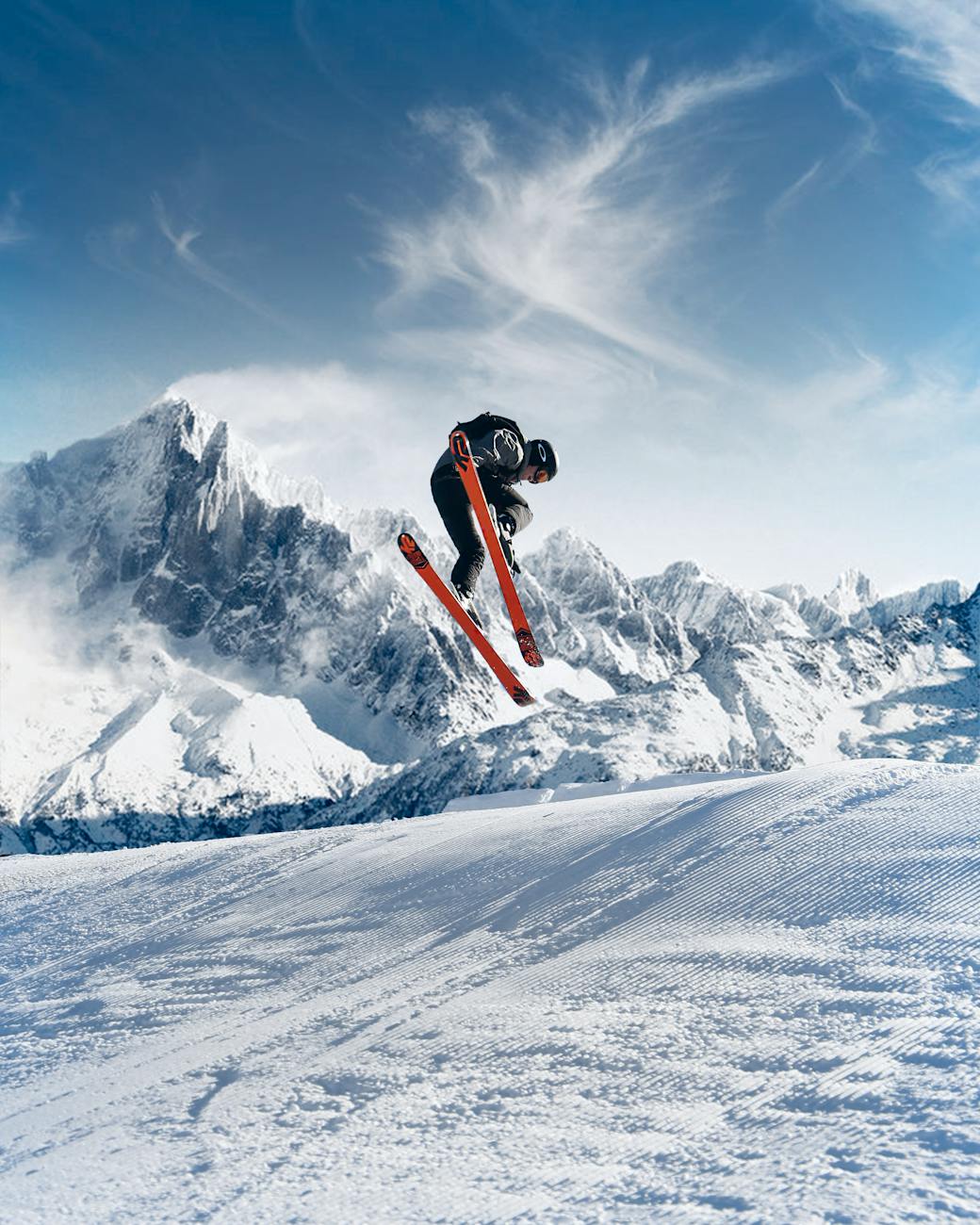 Dynamic ski jump in stunning snowy mountain landscape, epitomizing winter sports excitement.