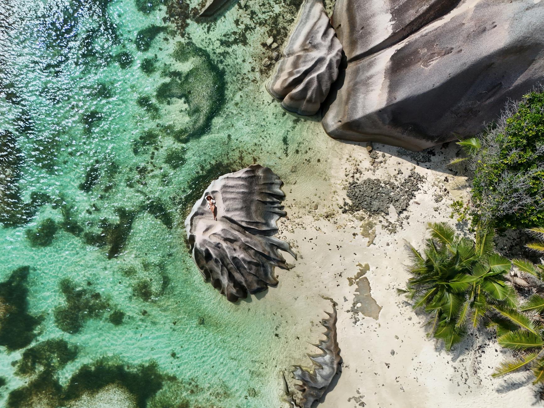 Stunning aerial view of a tropical beach with unique rock formations and clear turquoise water. Stunning aerial view of a tropical beach with unique rock formations and clear turquoise water.