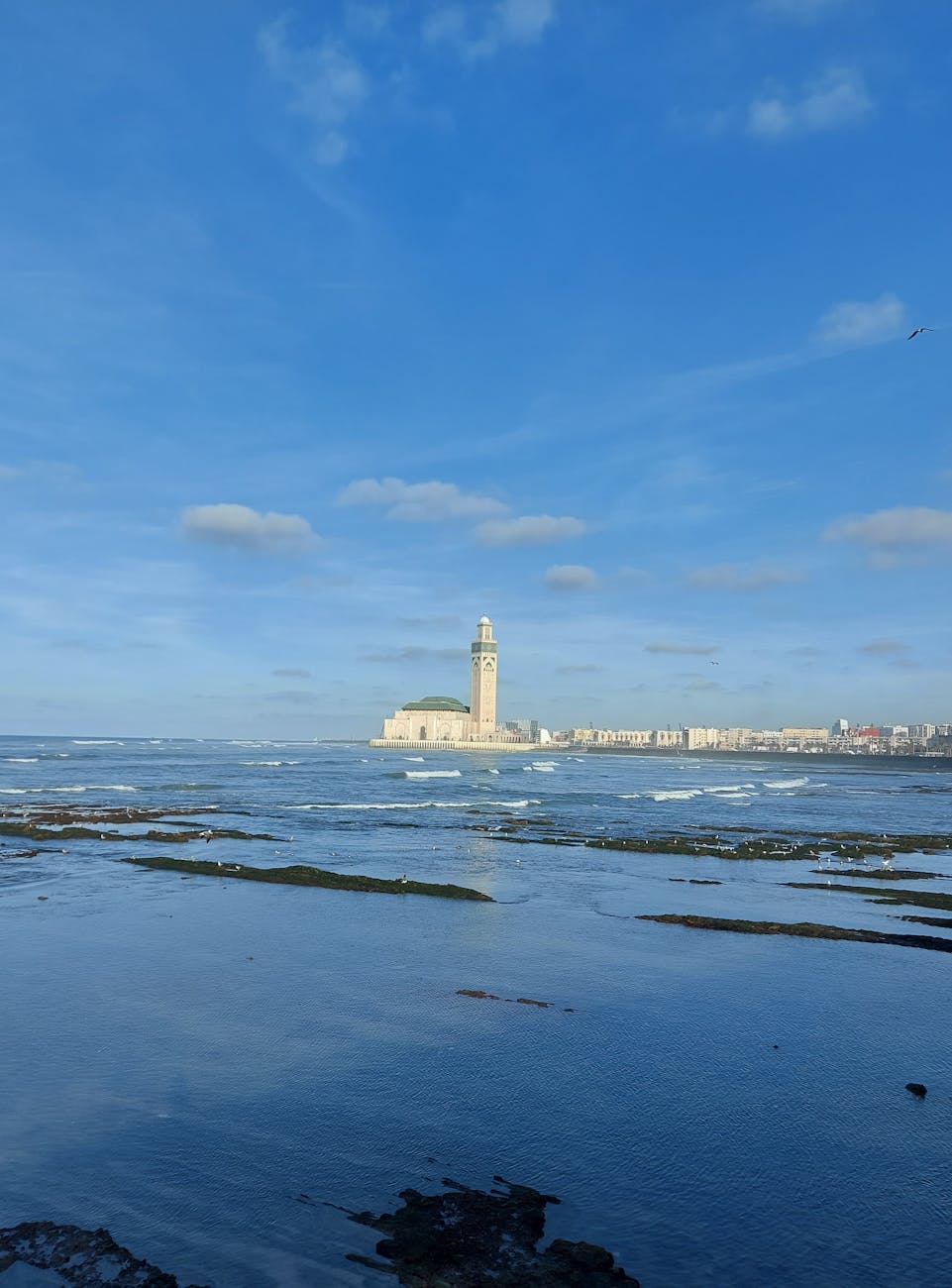 Stunning view of Hassan II Mosque by the Atlantic Ocean in Casablanca, Morocco.