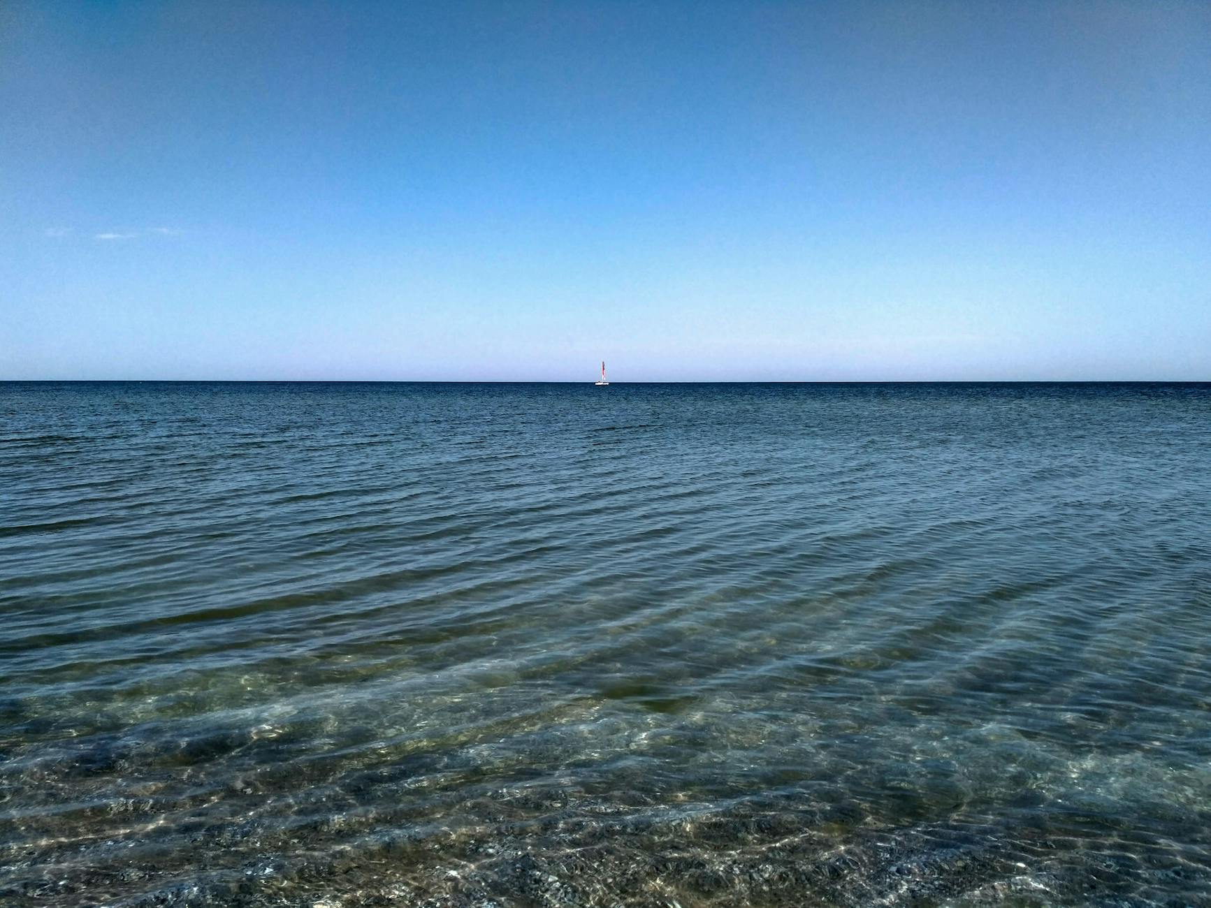 Calm Black Sea waters under a clear blue sky with horizon view, peaceful and serene. Calm Black Sea waters under a clear blue sky with horizon view, peaceful and serene.