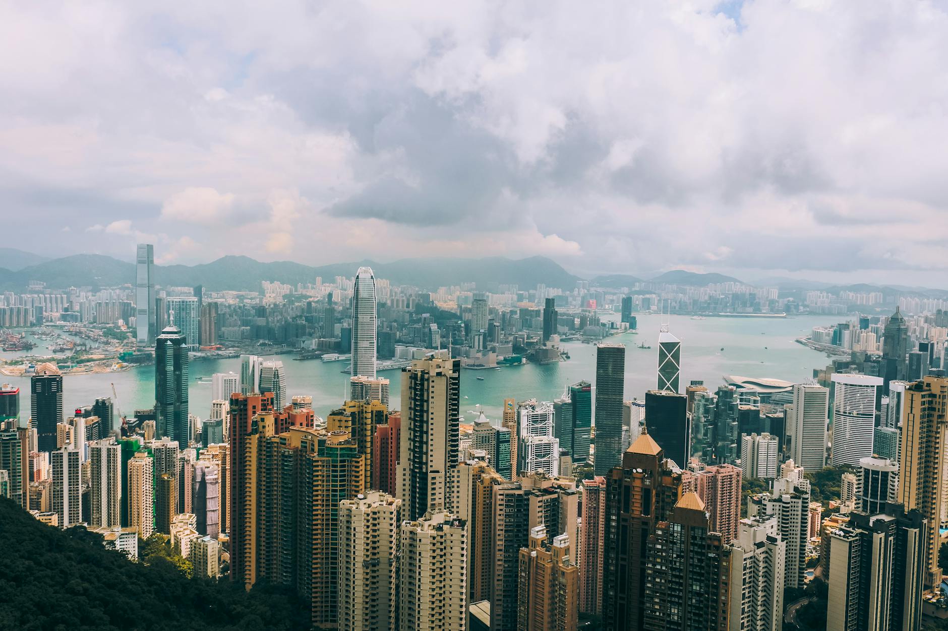 Panoramic view of Hong Kong skyline with skyscrapers and Victoria Harbour from Victoria Peak. Panoramic view of Hong Kong skyline with skyscrapers and Victoria Harbour from Victoria Peak.