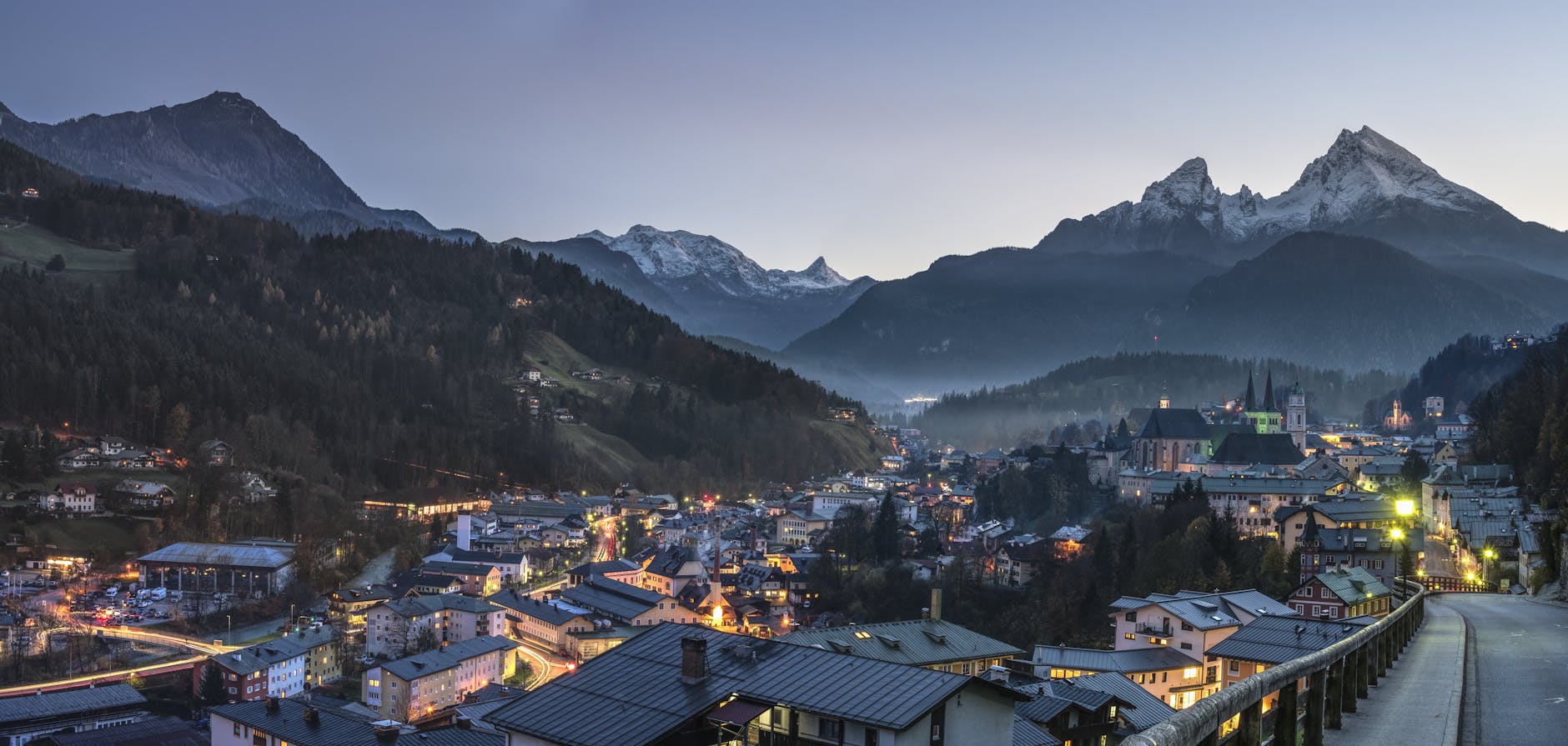 Scenic twilight view of Berchtesgaden town nestled in the Bavarian Alps with snow-capped peaks. Scenic twilight view of Berchtesgaden town nestled in the Bavarian Alps with snow-capped peaks.