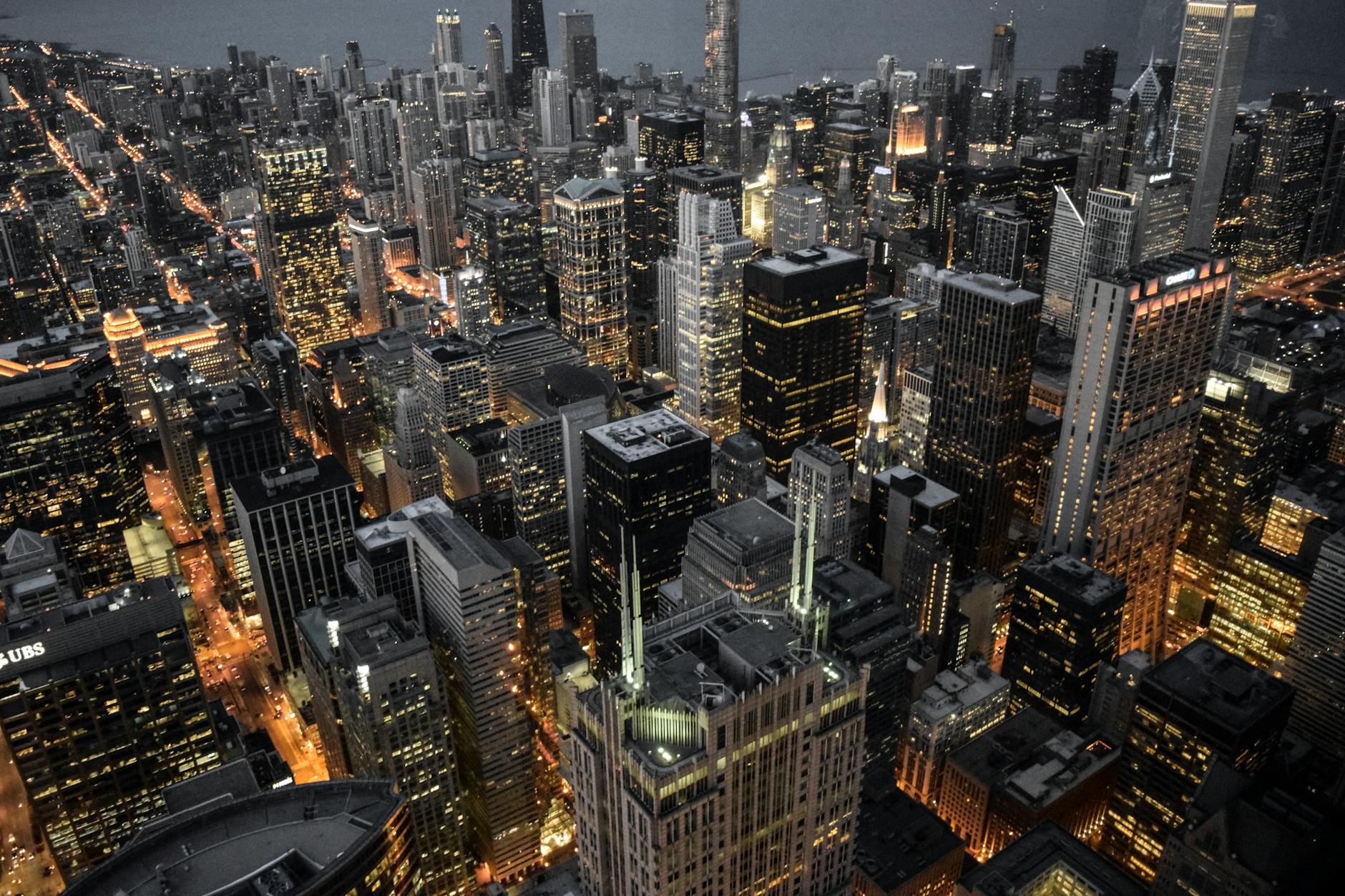Explore the vibrant skyline of Chicago with its illuminated skyscrapers and bustling urban life captured at dusk. Explore the vibrant skyline of Chicago with its illuminated skyscrapers and bustling urban life captured at dusk.