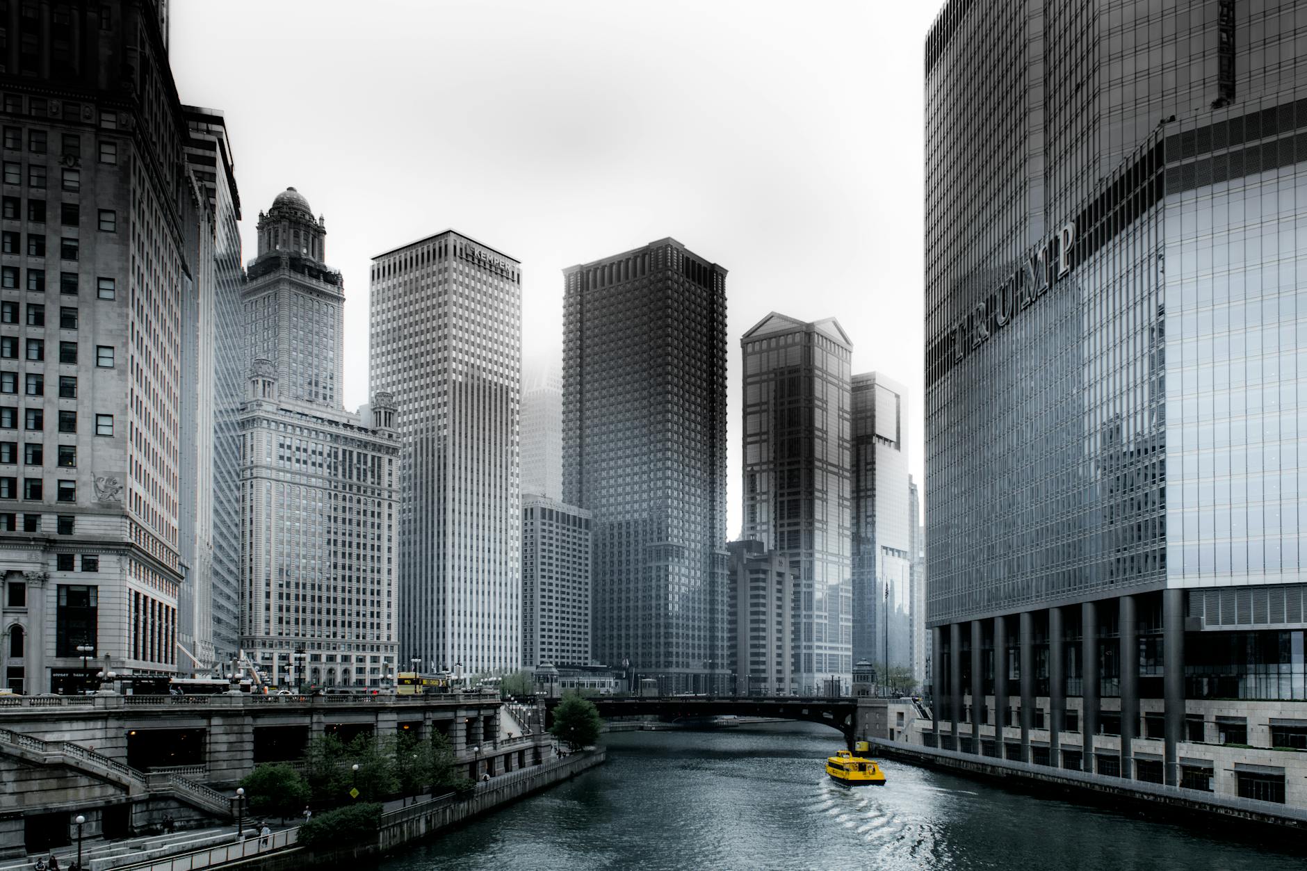 Stunning view of Chicago’s skyscrapers along the river with a yellow water taxi.