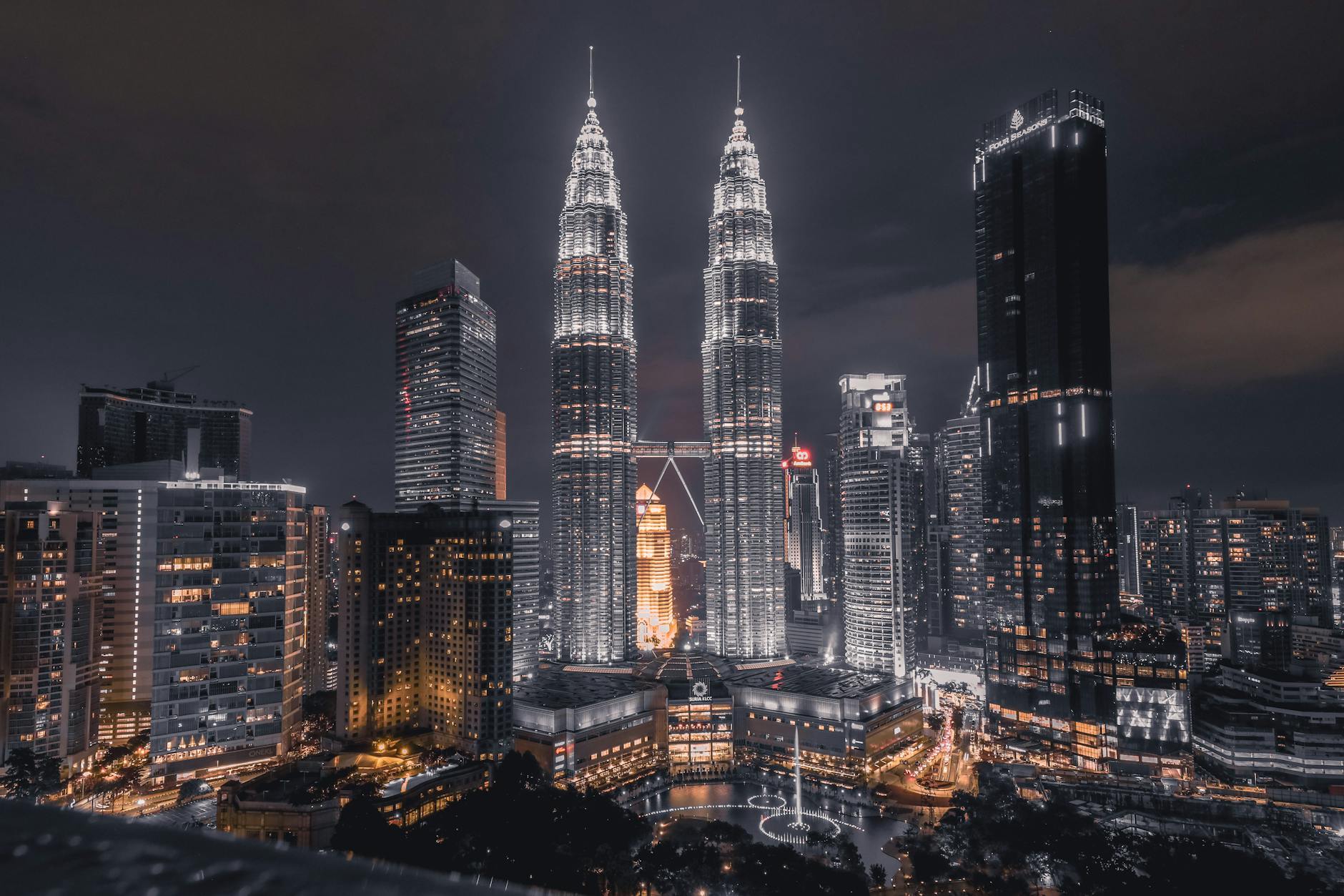 A breathtaking night view of Kuala Lumpur’s skyline featuring the illuminated Petronas Towers. A breathtaking night view of Kuala Lumpur’s skyline featuring the illuminated Petronas Towers.