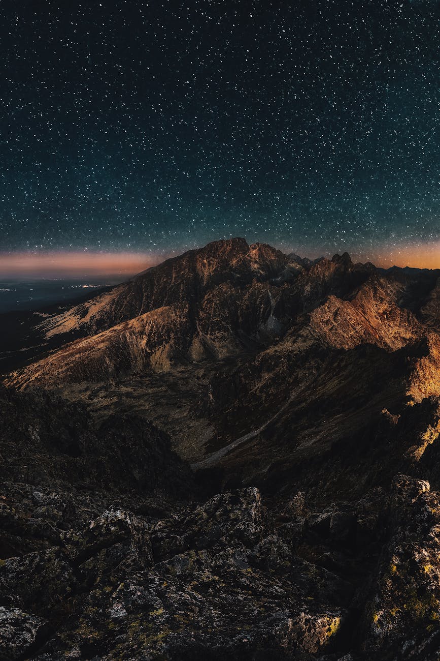 Stunning starry night sky over rugged mountains, perfect for nature lovers. Stunning starry night sky over rugged mountains, perfect for nature lovers.