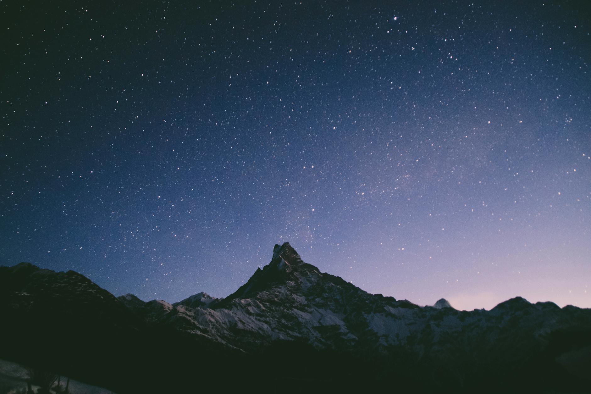 Starry night sky over snow-capped Annapurna range in Nepal’s Western Development Region.