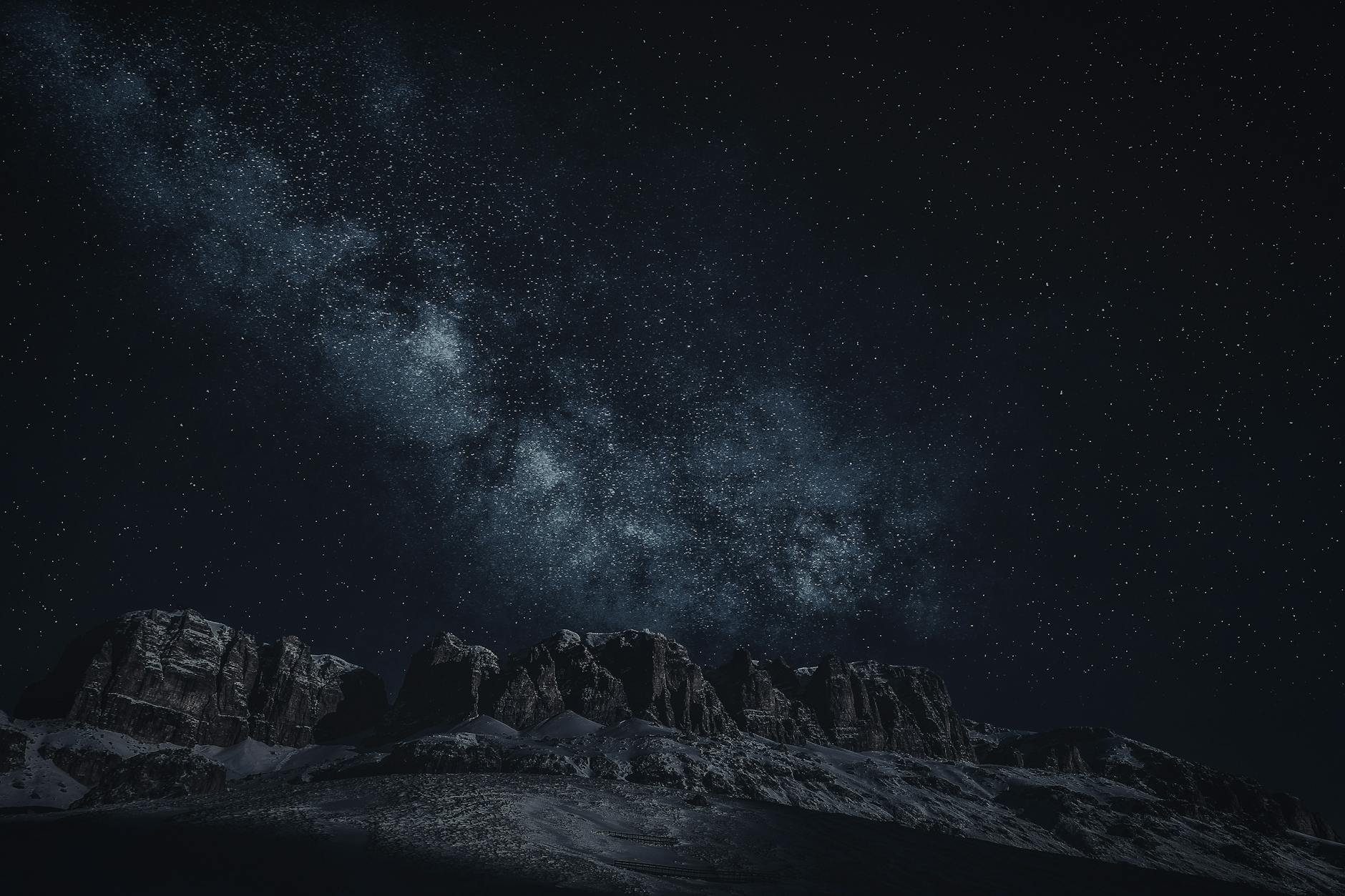 Majestic view of the Milky Way above rugged mountain ranges under a starry sky.