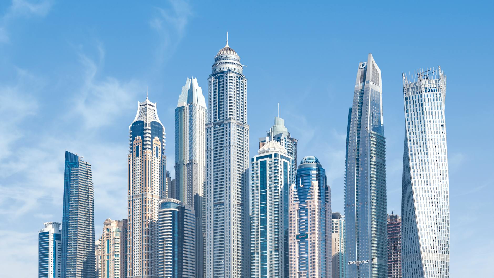 Stunning view of Dubai’s iconic skyscrapers under a clear blue sky.
