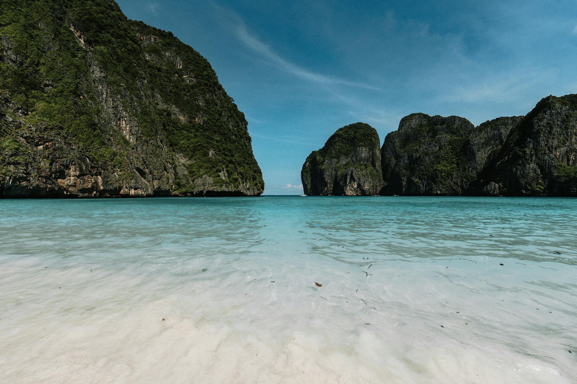 Breathtaking view of Maya Bay’s turquoise waters and limestone cliffs in Krabi, Thailand. Breathtaking view of Maya Bay’s turquoise waters and limestone cliffs in Krabi, Thailand.