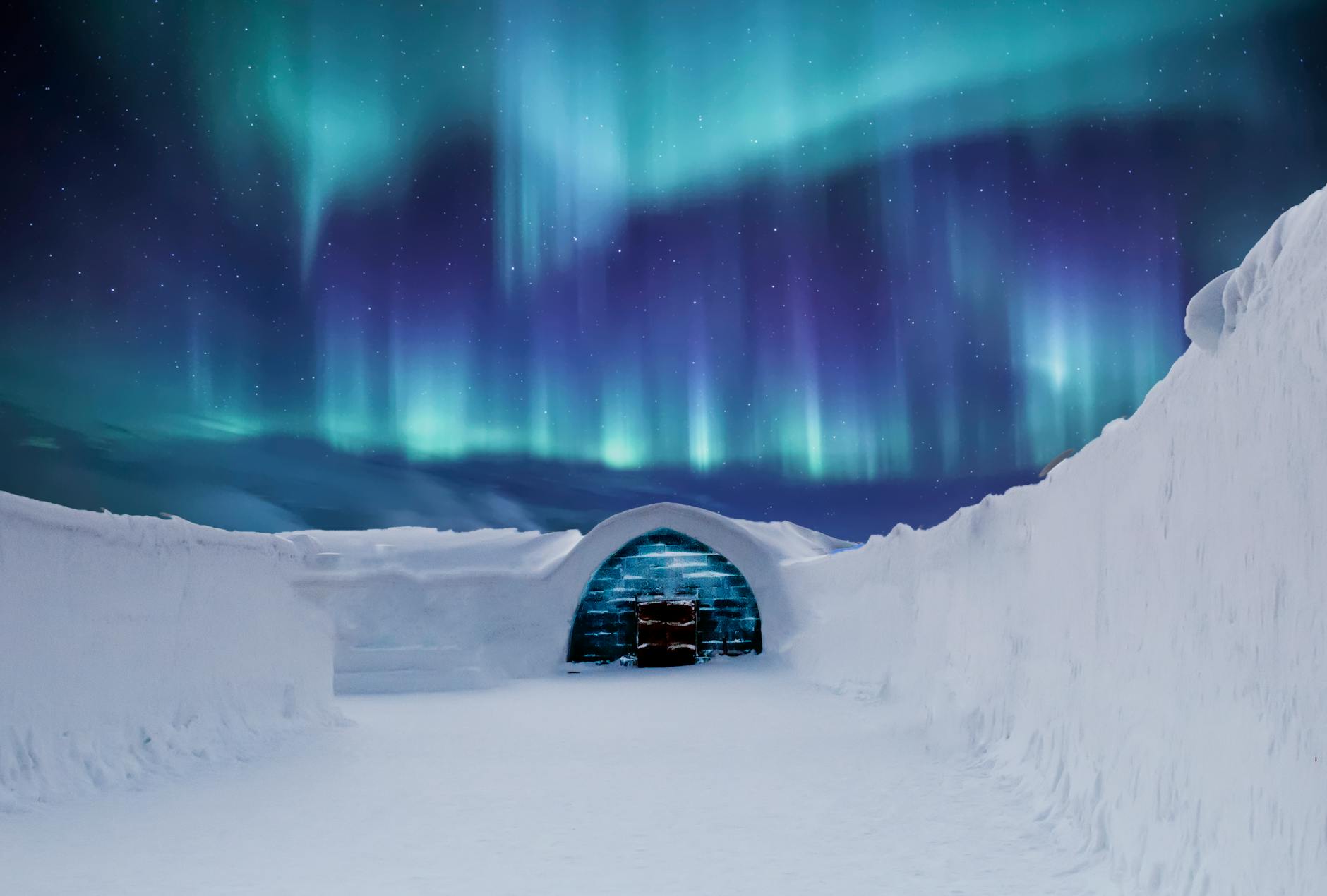 Captivating northern lights illuminate a snowy igloo in the Arctic landscape at night. Captivating northern lights illuminate a snowy igloo in the Arctic landscape at night.