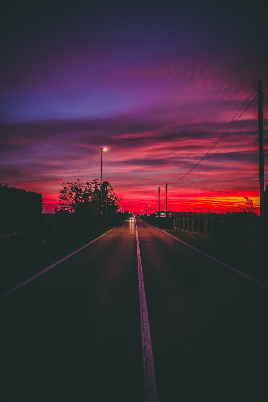 A captivating night view of a road under a dramatic twilight sky in Villafranca di Verona, Italy. A captivating night view of a road under a dramatic twilight sky in Villafranca di Verona, Italy.